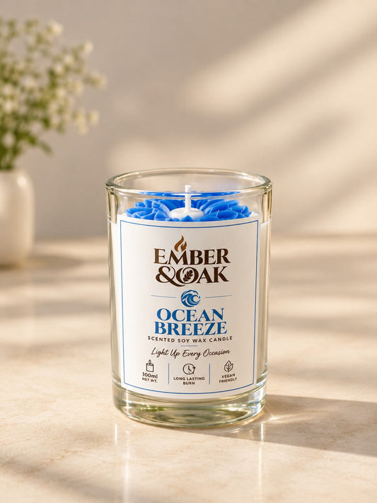 Ember & Oak Ocean Breeze 100 ml candle, a moulded blue bloom set in clear glass
